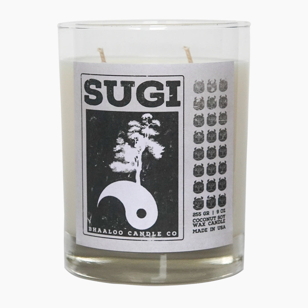 Double wicked scented candle. Black and white decorative label on glass vessel